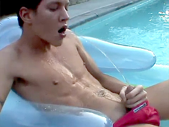 Nude boy pissing in his mouth by the swimming pool
