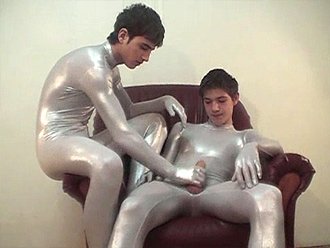 Nude boys in silver spandex bodysuits have fun